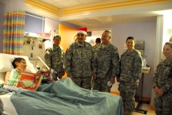 4th Regiment troops deliver Christmas cheer to the children at Cook Children's Hospital in Fort Worth, Texas.Photo by PV2 Byron Sims